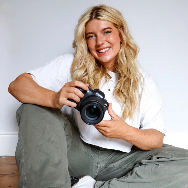 Nina Collins holding a Canon camera